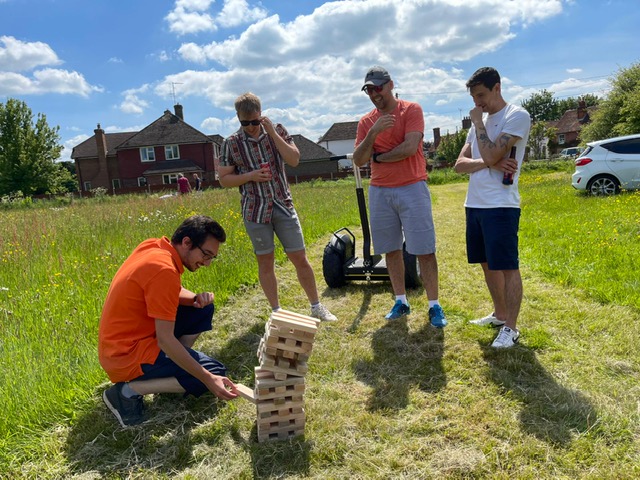 amatis team playing mega jenga